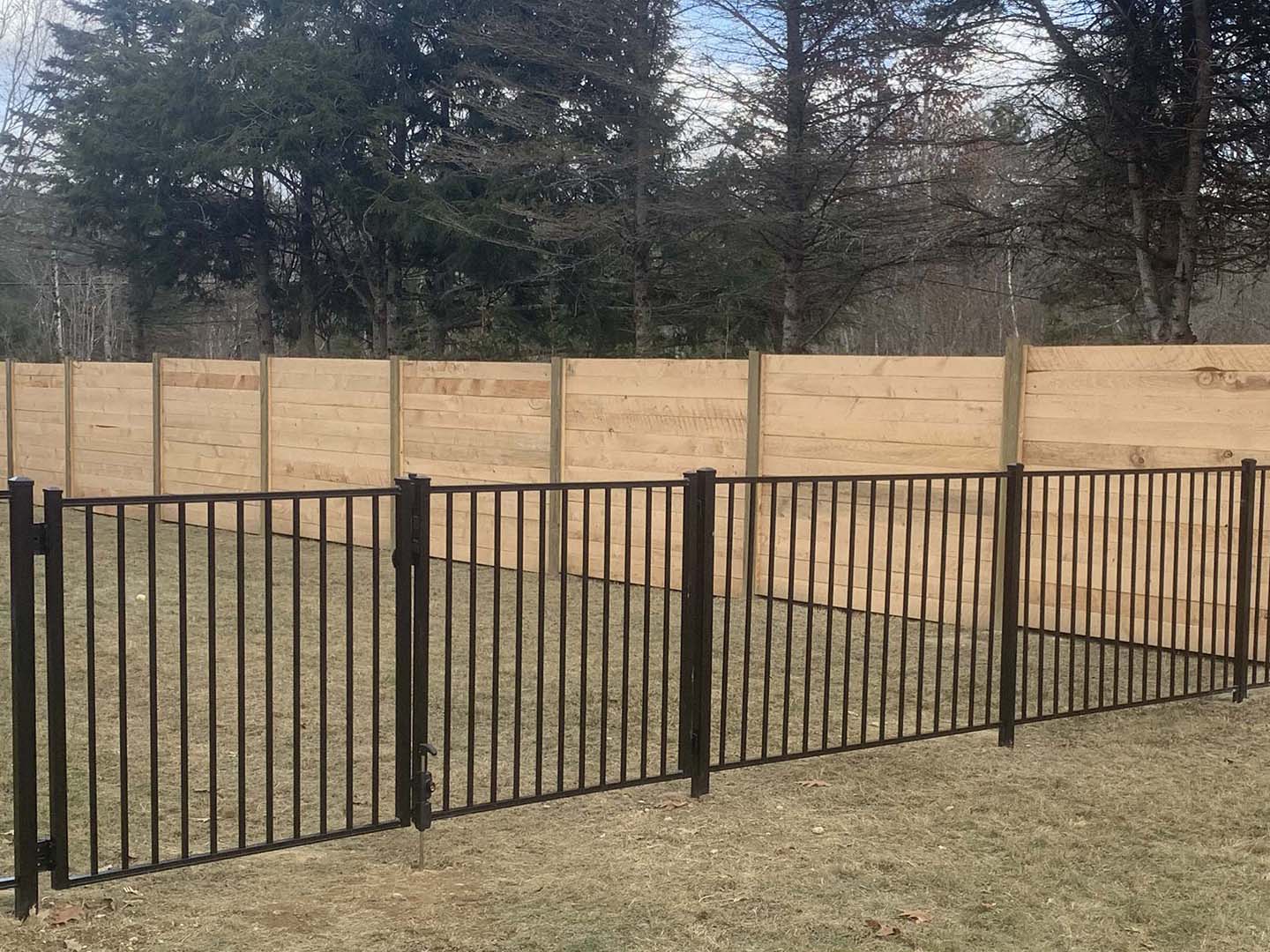 Photo of a Southern New Hampshire wood fence and a Southern New Hampshire aluminum fence